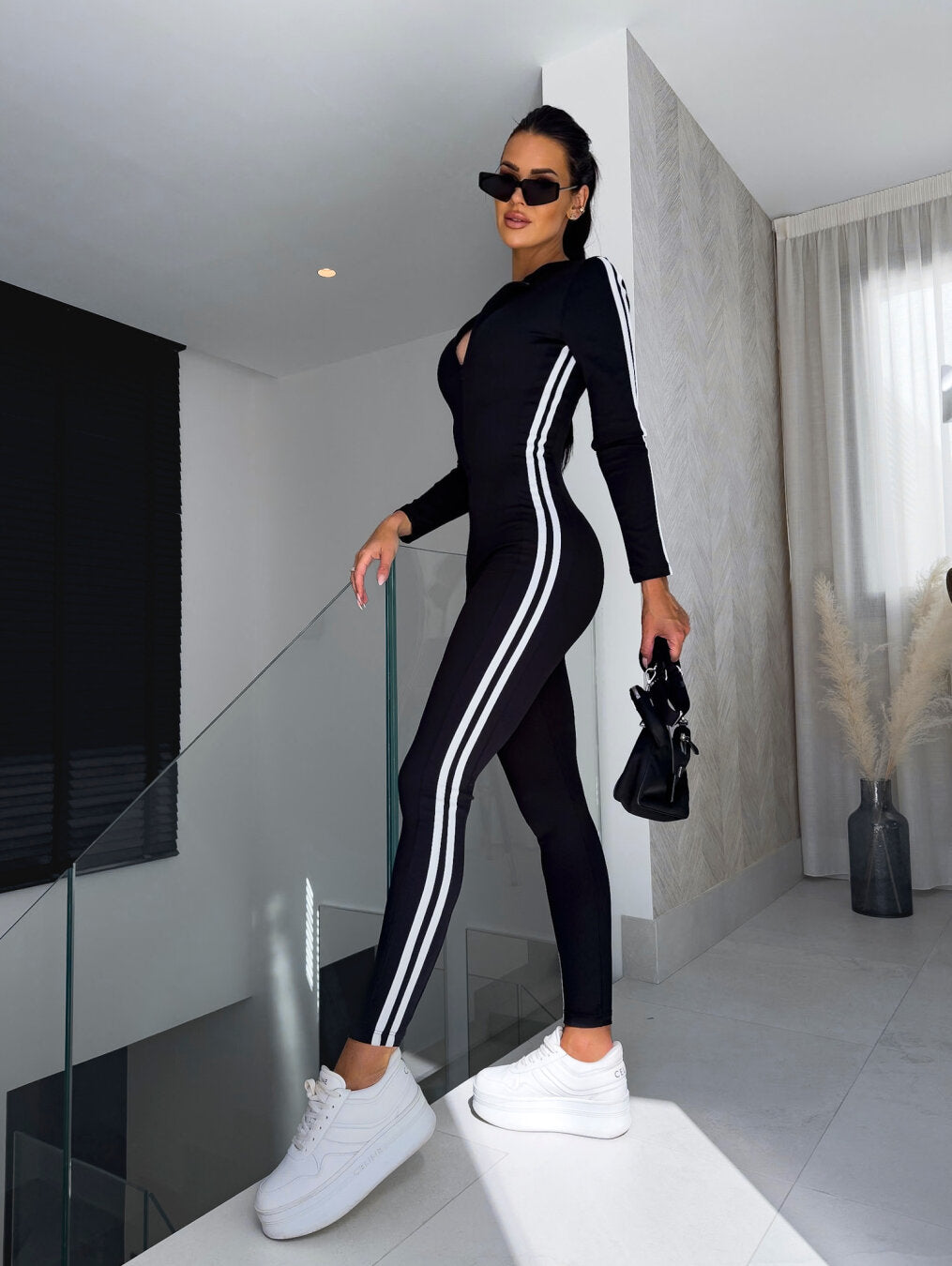 EB | Dynamischer Jumpsuit Mit Streifen