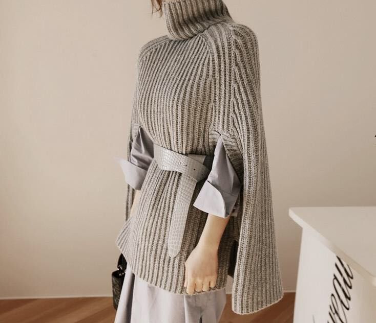 Damen Strickpullover mit hohem Kragen und asymmetrischem Schnitt EB