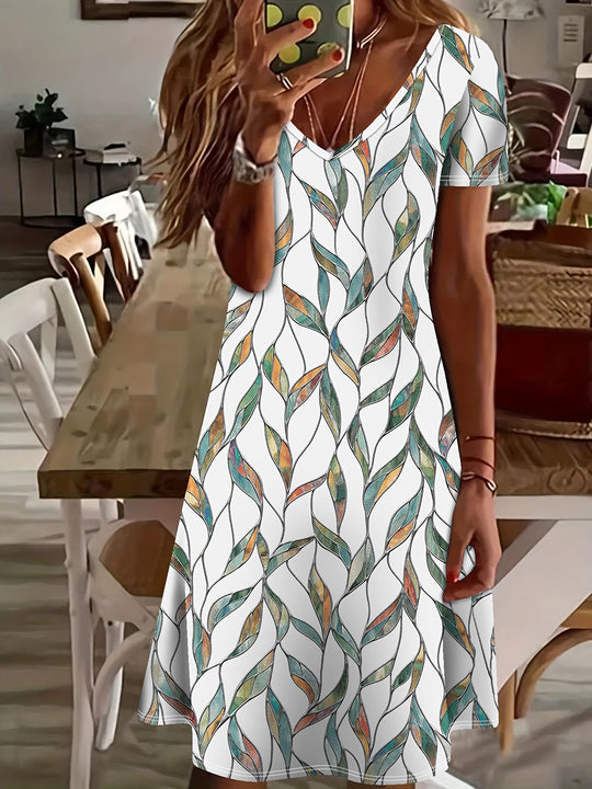 EB | Sommerkleid mit Blättermuster Enganliegendes Midi-Kleid mit V-Ausschnitt
