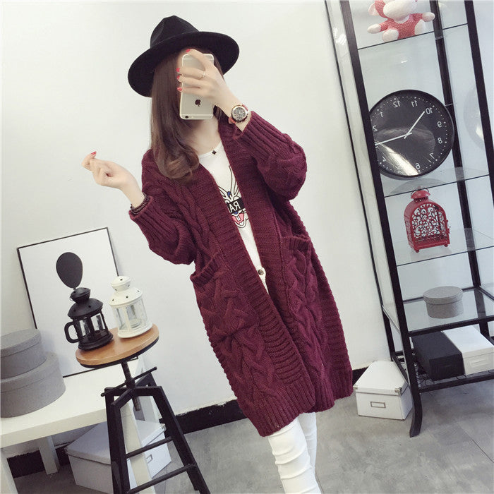 Damen Grobstrickjacke mit elegantem Zopfmuster und praktischen Taschen EB