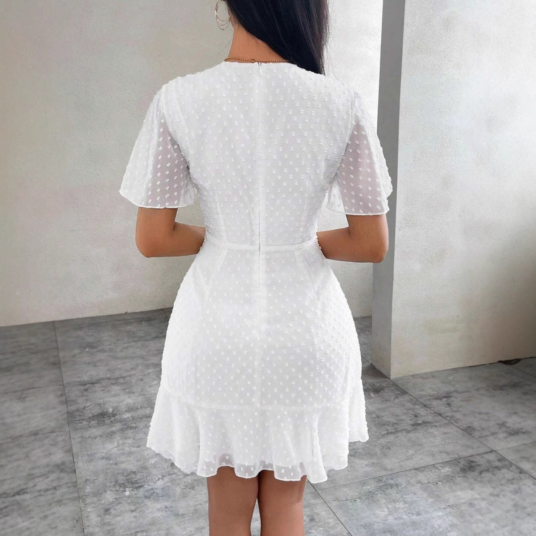 EB | Dreidimensionales Kleid mit Rüschenrand und Punkten
