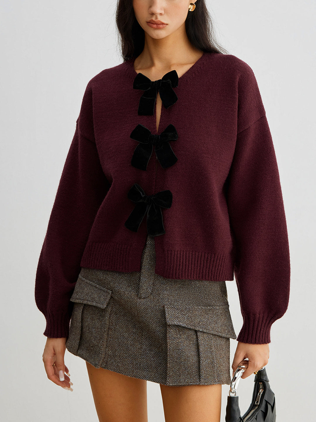 EB | Strickcardigan mit Samtschleifen Wollmischung Feminin und Modern