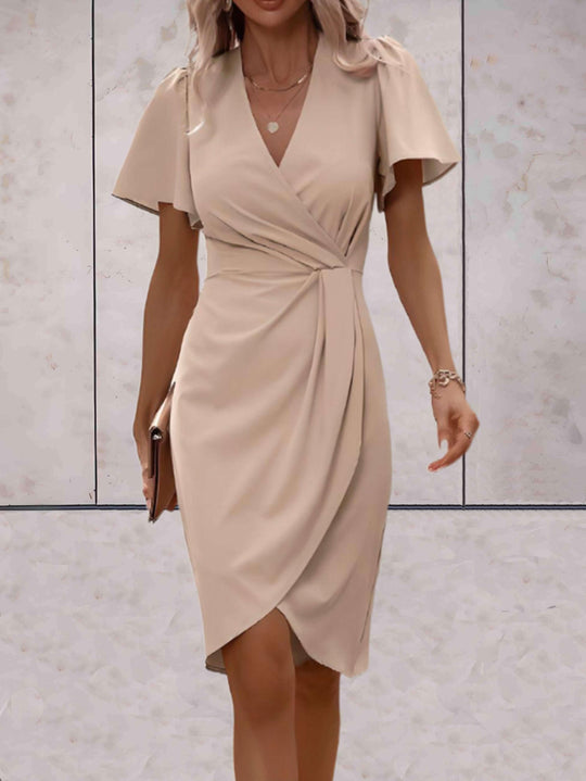elegante wikkeljurk met korte mouwen