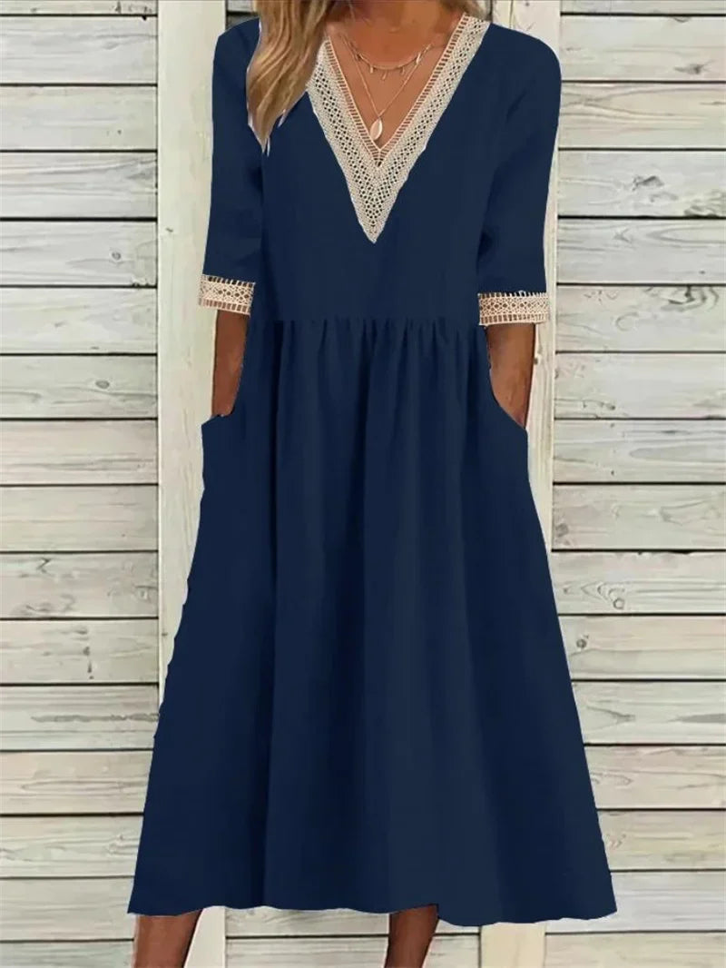 Kleid mit Spitzenverzierung und halben Ärmeln