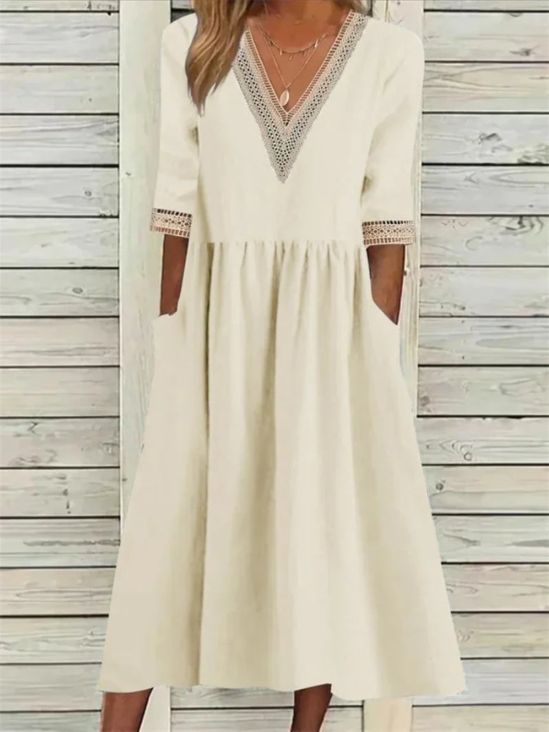 Kleid mit Spitzenverzierung und halben Ärmeln