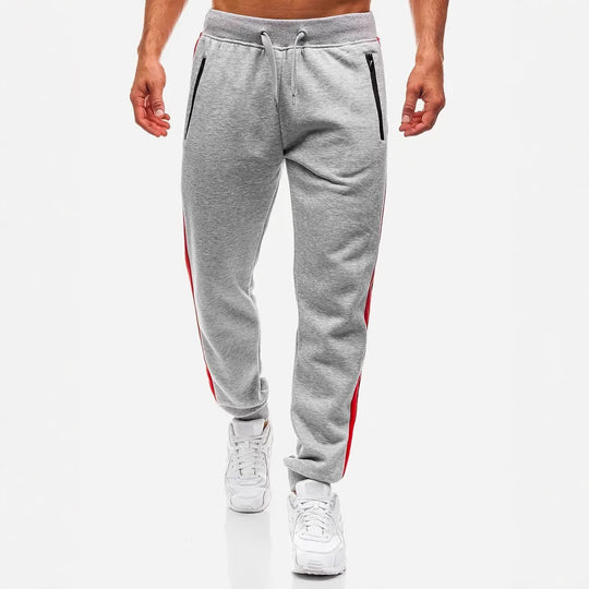 Herren nan schmal zulaufende Fleece-Jogginghose mit zweifarbiger Seitenpaspel und wasserabweisenden Reißverschlusstaschen EB