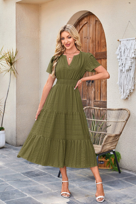 EB | Kleid mit V-Ausschnitt und plissierten Blasenärmeln