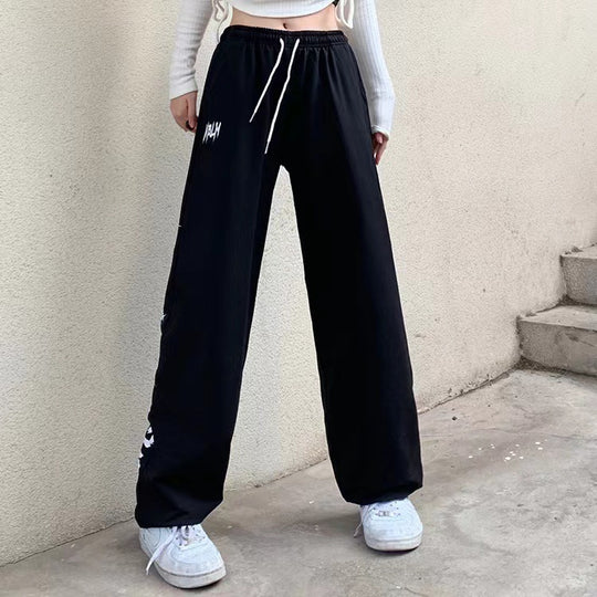 Damen nan locker geschnittene Wide‑Leg Jogginghose mit hohem Bund und markantem Seitenschriftzug EB