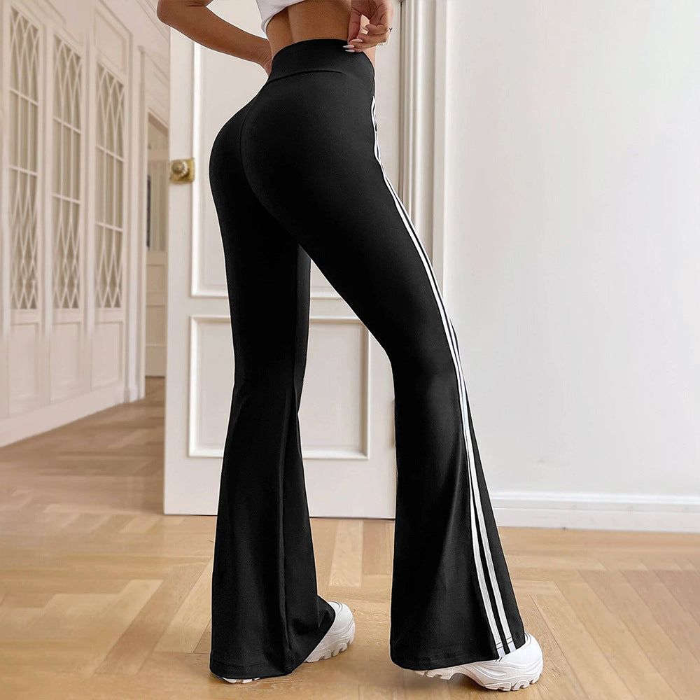 Damen hochgeschnittene Flared-Sporthose mit taillenformendem Komfortbund und seitlichen Kontraststreifen Eichborn Berlin