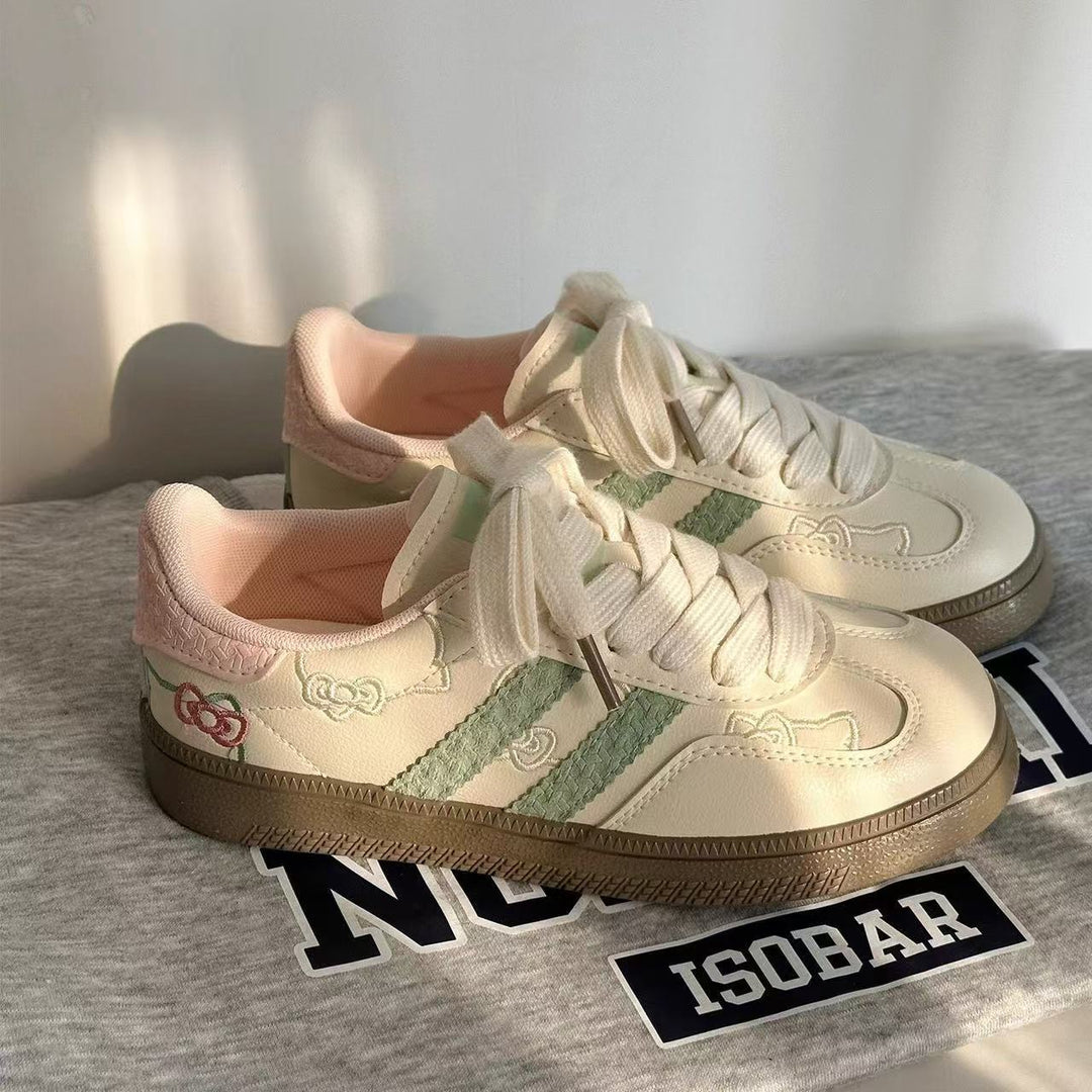 Damen Sneaker mit floralen Applikationen und elastischen Schnürsenkeln EB