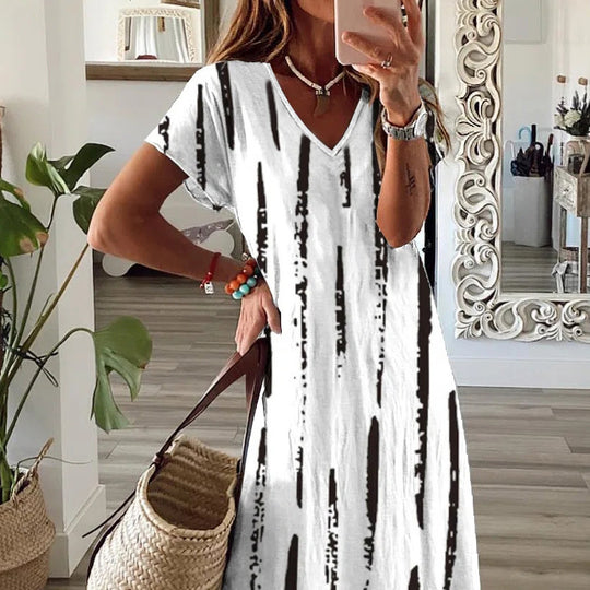 Damen Maxikleid im modernen Mustermix mit V-Ausschnitt und hohem Schlitz EB