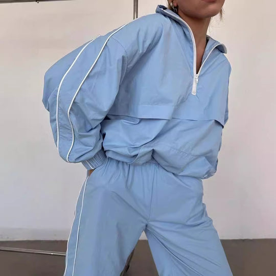 Damen winddichter Crop-Halfzip-Trainingsanzug mit elastischem Bund und kontrastierender Paspel Eichborn Berlin