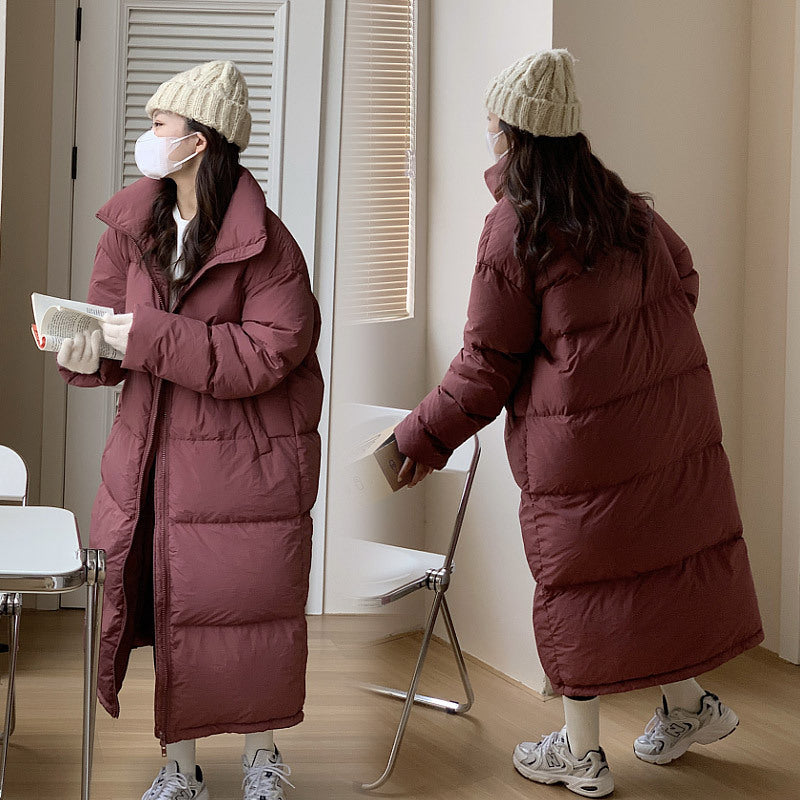 Damen Lange Pufferjacke mit Kapuze und voluminösem Schnitt EB