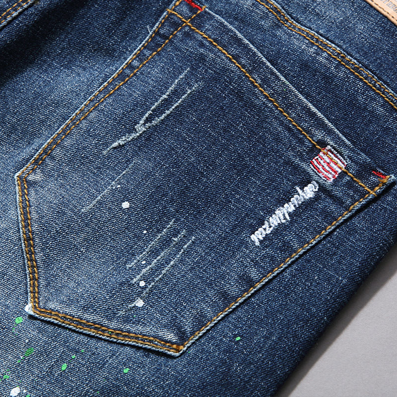 Herren modische Jeans mit kreativen Farbklecksen und Rissdesign EB