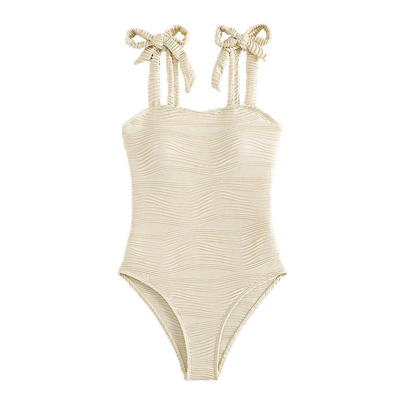 Damen Einteiler Badeanzug mit Wellenstruktur und modischen Trägerschleifen EB