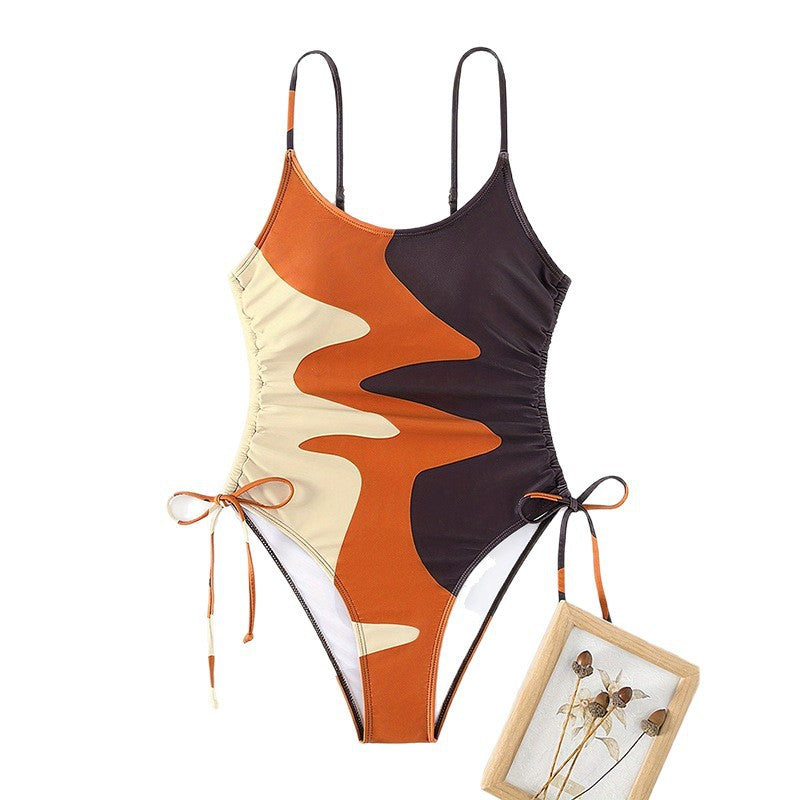 Damen Einteiler Badeanzug mit asymmetrischem Muster und verstellbarem Bindeband EB