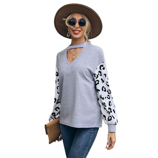 Damen Sweatshirt mit V-Ausschnitt und trendigen Leopardenärmel EB