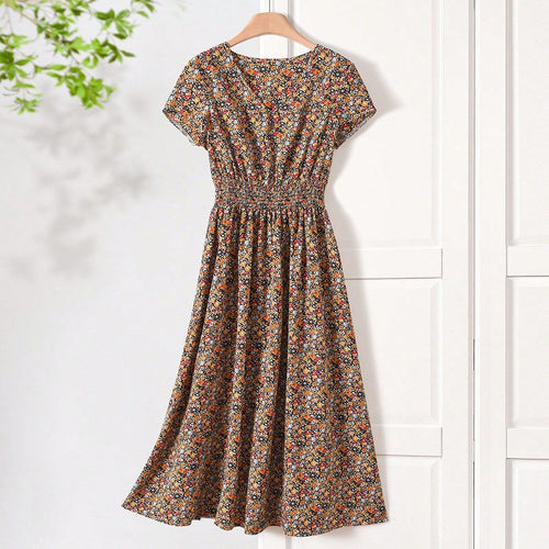 Damen Sommerliches Midikleid mit elastischem Bund und floralen Mustern EB