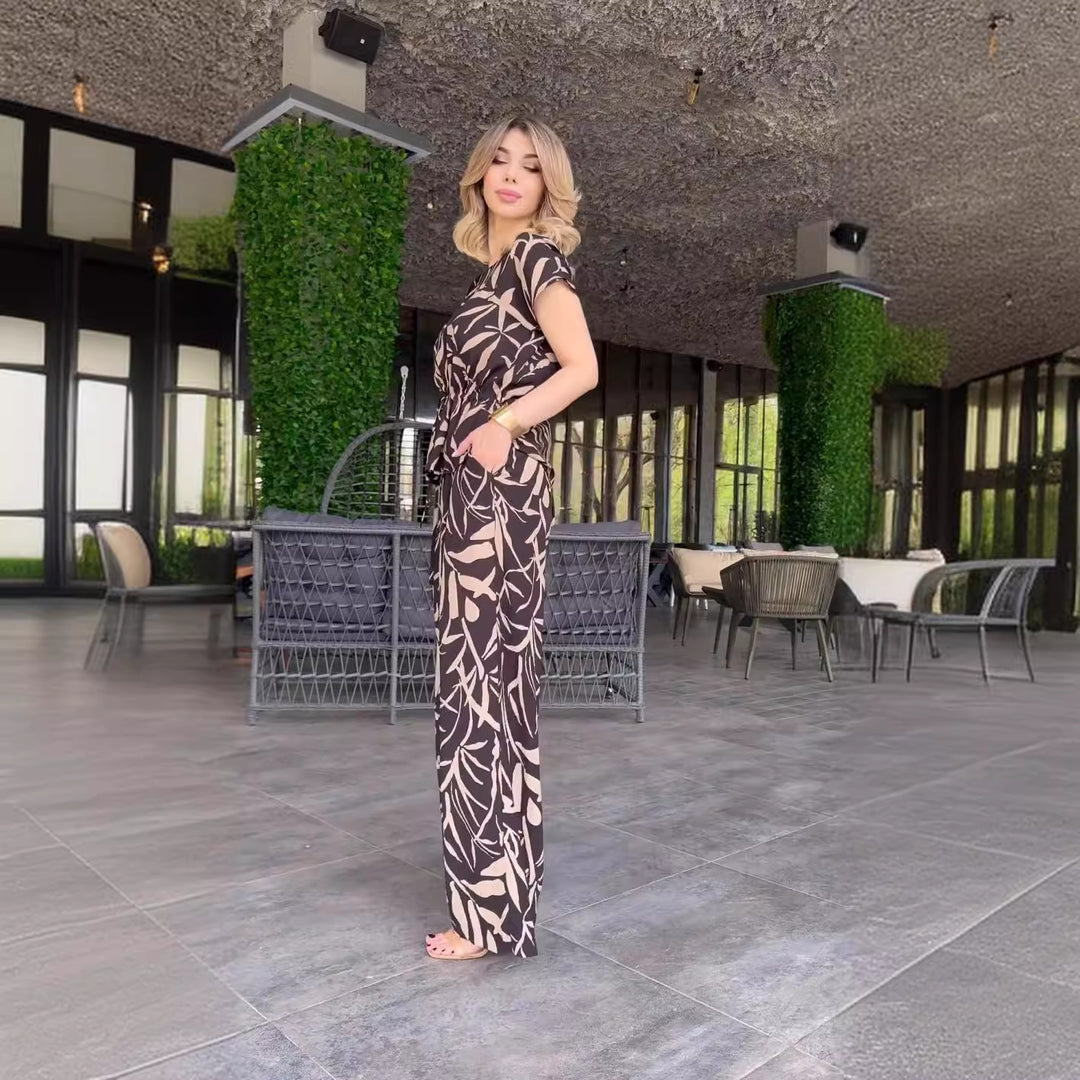 Damen Flowing Jumpsuit mit floralem Design und elastischer Taillierung EB