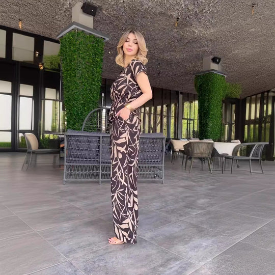 Damen Flowing Jumpsuit mit floralem Design und elastischer Taillierung EB