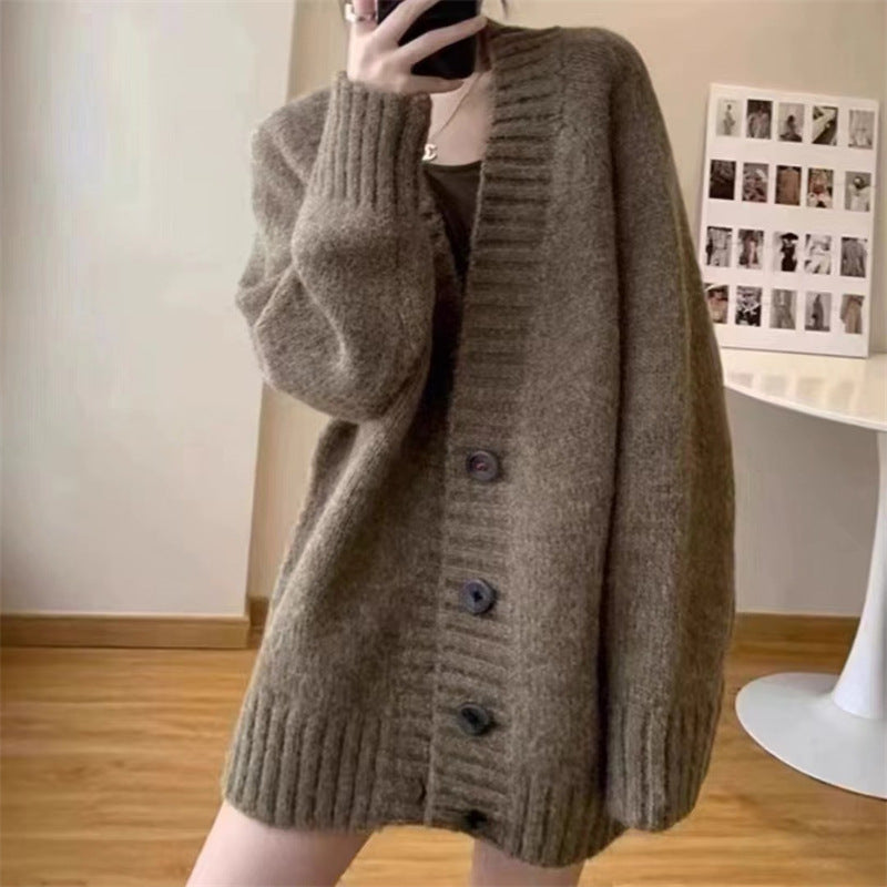 Damen Grobstrickjacke mit voluminösen Ärmeln und knöpfbarem Ausschnitt EB
