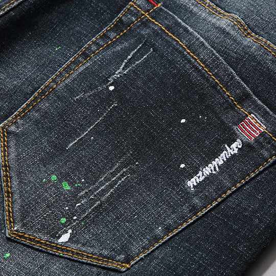 Herren Slim Fit Jeans mit kreativen Rissdesign und Farbklecksen EB