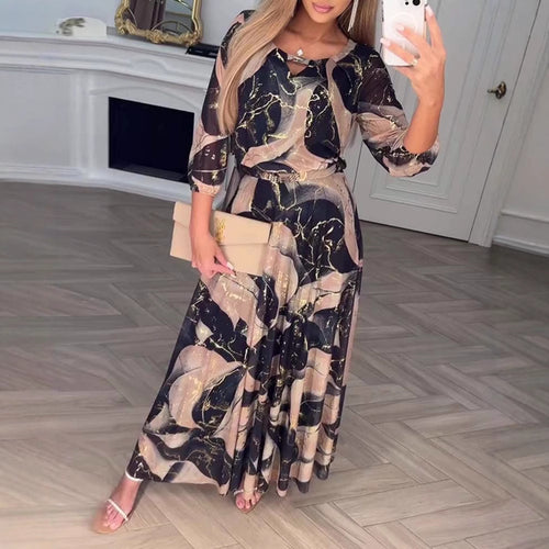 Damen Maxikleid mit elegantem Druckdesign und fließendem Schnitt Heidi-Mode