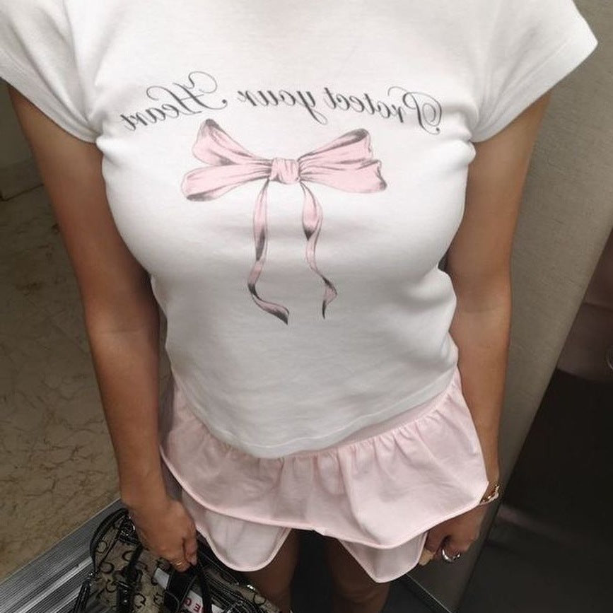Damen Crop-Top mit kreativem Schleifenmotiv und inspirierendem Schriftzug EB