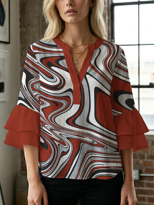 Damen Bluse mit voluminösen Flügelärmel und intensivem Blattmuster EB