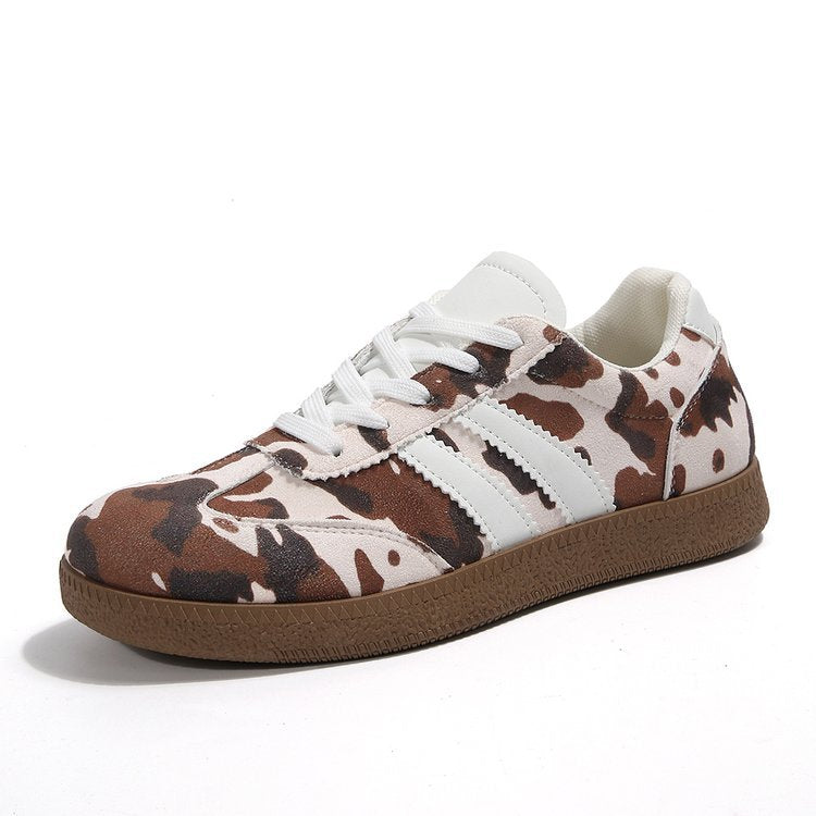 Damen Sportliche Sneakers mit trendigem Kuhdesign EB