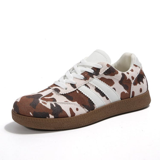 Damen Sportliche Sneakers mit trendigem Kuhdesign EB