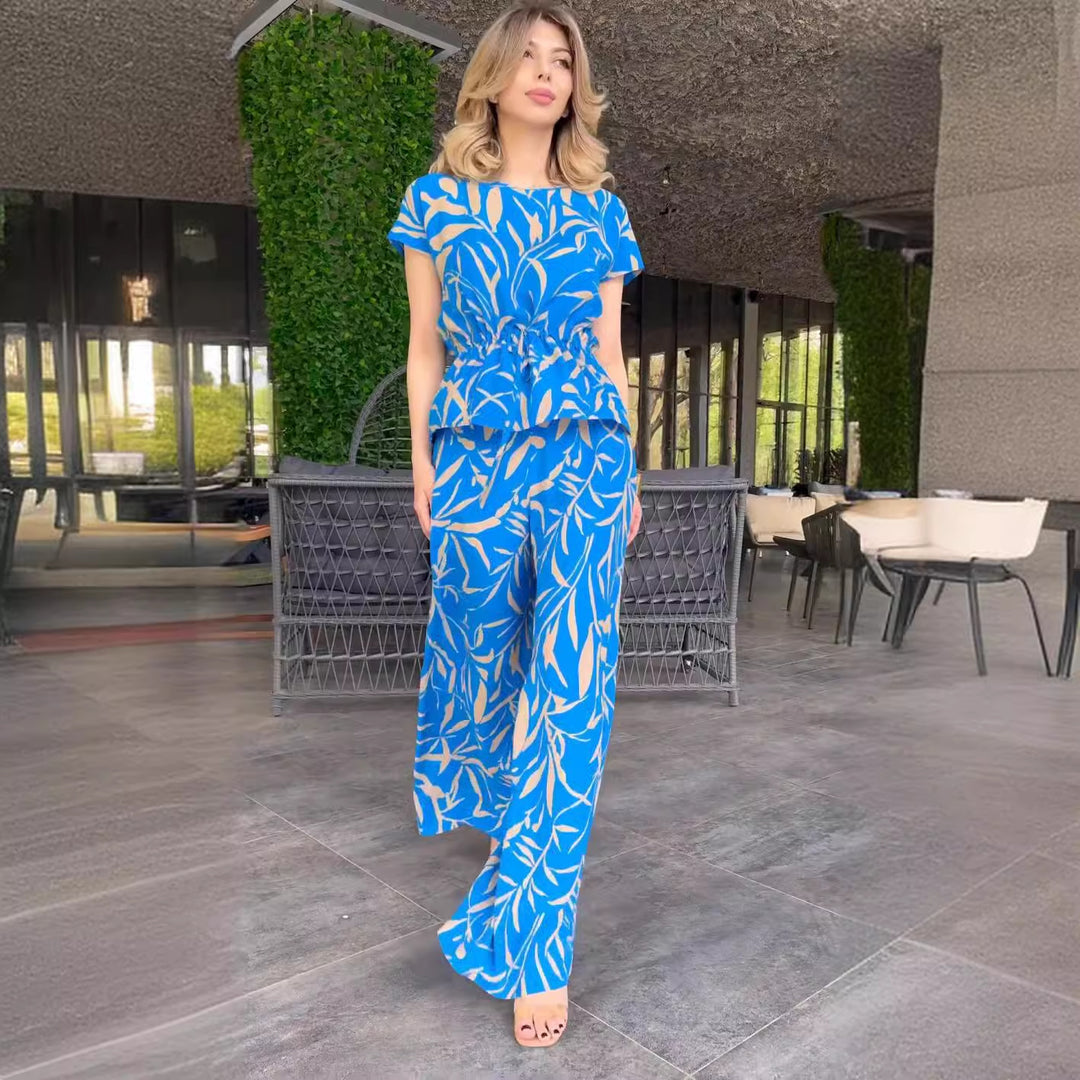 Damen Flowing Jumpsuit mit floralem Design und elastischer Taillierung EB