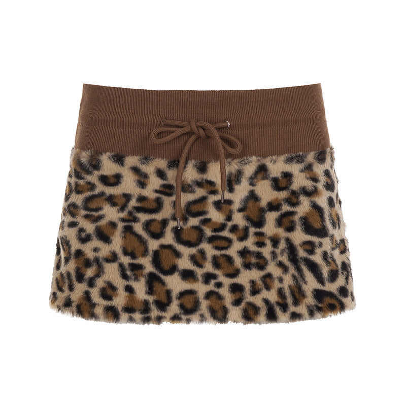 Damen eleganter Minirock aus fellartigem Material mit Modellknopf und Taillenband EB
