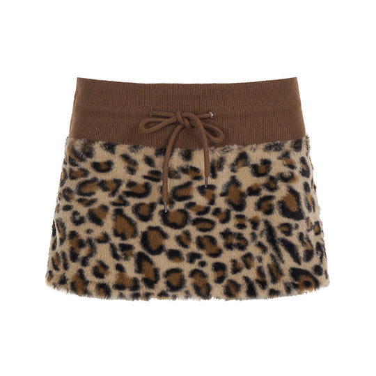 Damen eleganter Minirock aus fellartigem Material mit Modellknopf und Taillenband EB