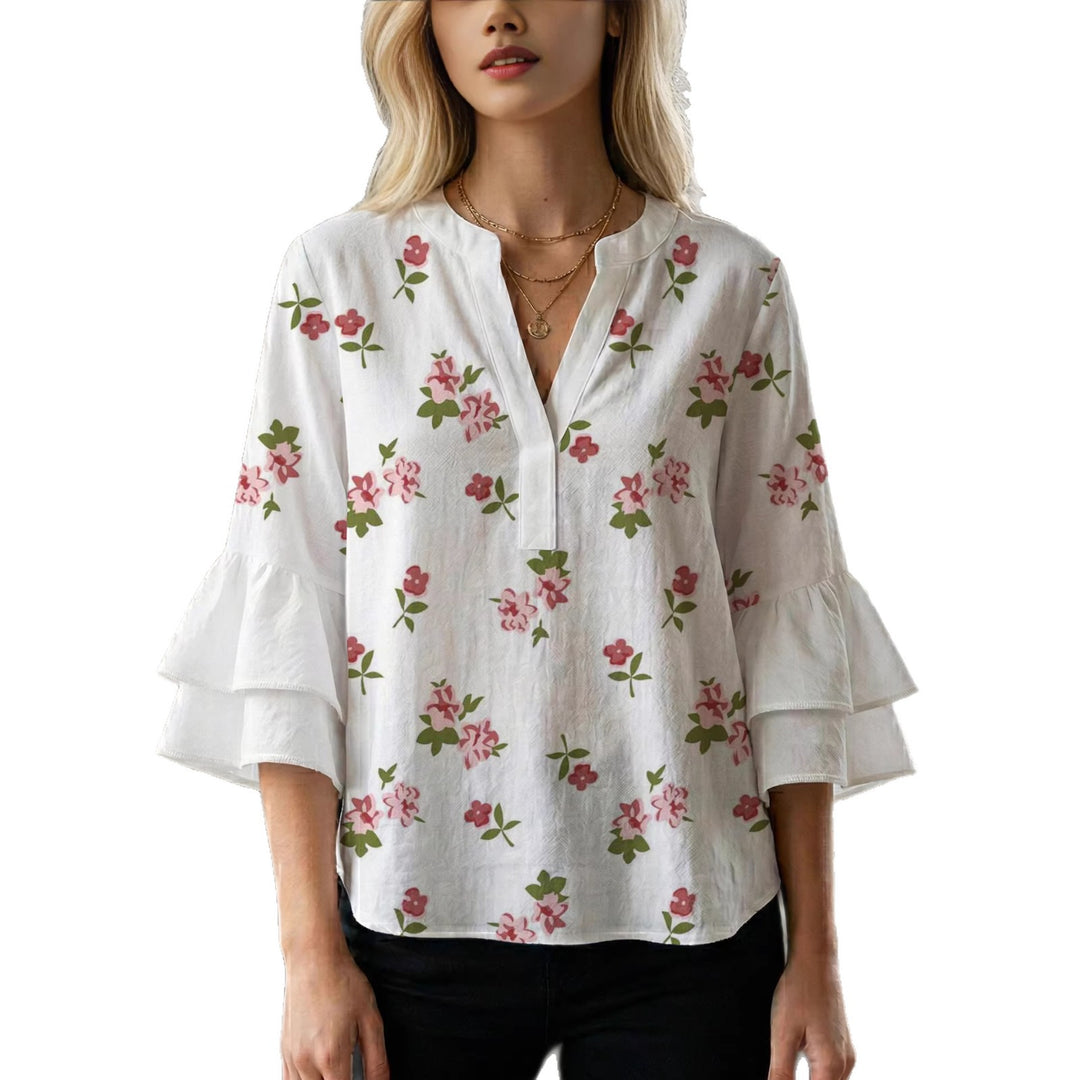 Damen Bluse mit voluminösen Rüschenärmeln und modernem Motiv EB