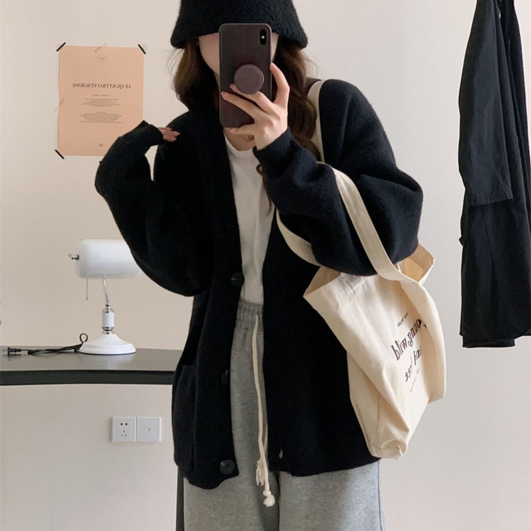 Damen Gemütliche Strickjacke mit weiten Ärmeln und praktischen Taschen EB