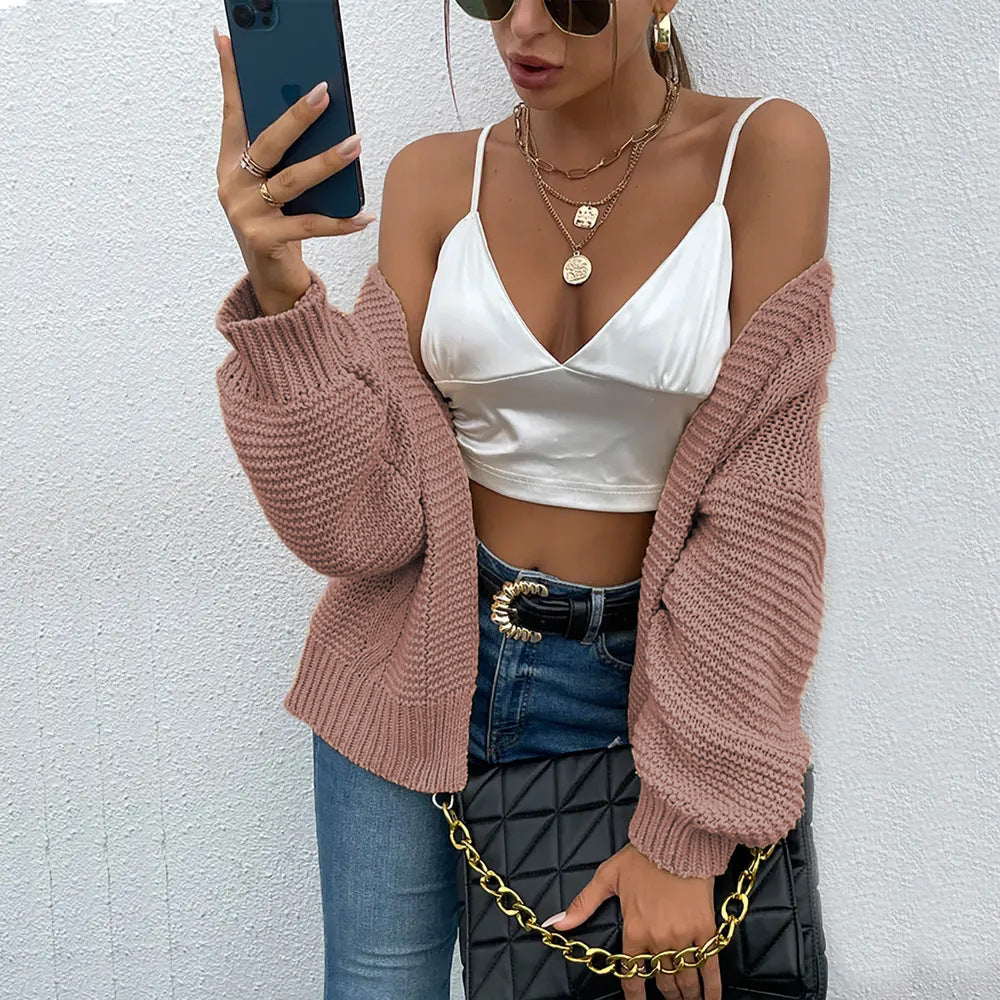 Damen Strickjacke mit voluminösen Ärmel und stylischem Rippenmuster EB