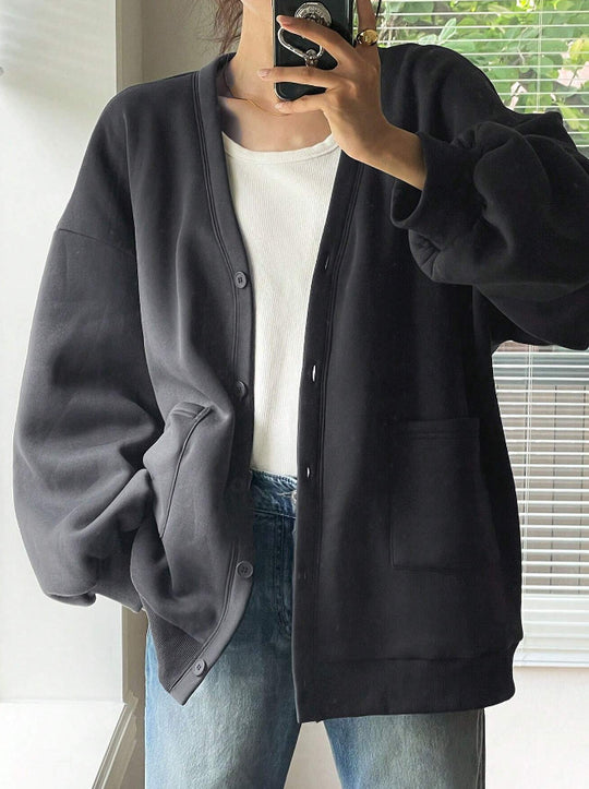 Damen Oversized Sweatcardigan mit Knopfleiste, aufgesetzten Taschen und überschnittener Schulter EB