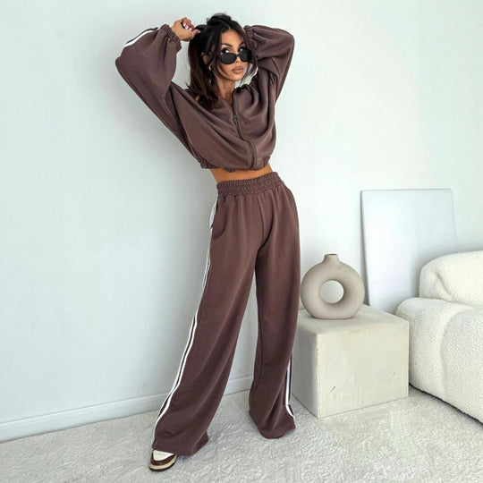 Damen cropped Zip-Hoodie mit voluminösen Ballonärmeln und High-Waist Relaxhose im sportlichen Seitenstreifen-Design Eichborn Berlin