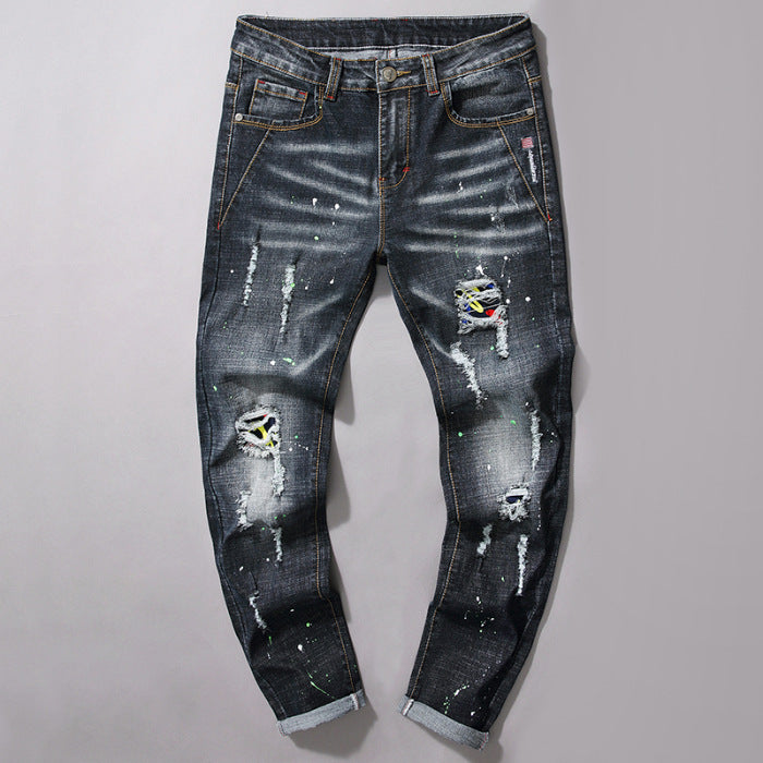 Herren Slim Fit Jeans mit kreativen Rissdesign und Farbklecksen EB