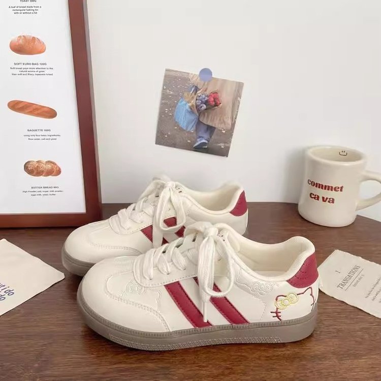Damen Sneakers im verspielten Design mit Hello Kitty-Applikationen EB