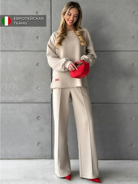 Damen eleganter Lounge-Zweiteiler mit Oversize-Sweatshirt und taillierter Weitbein-Hose Eichborn Berlin