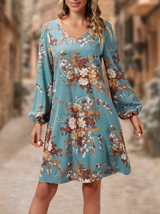 Damen Blusenkleid mit floralem Design und voluminösen Ärmeln EB