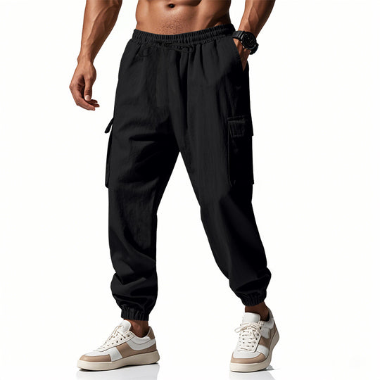 Herren nan konisch zulaufende Jogger im utilitarischen Stil mit elastischem Bund, Kordelzug und Klappentaschen EB