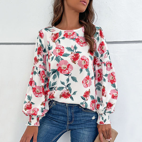 Damen Bluse mit floralem Design und voluminösen Ärmeln EB
