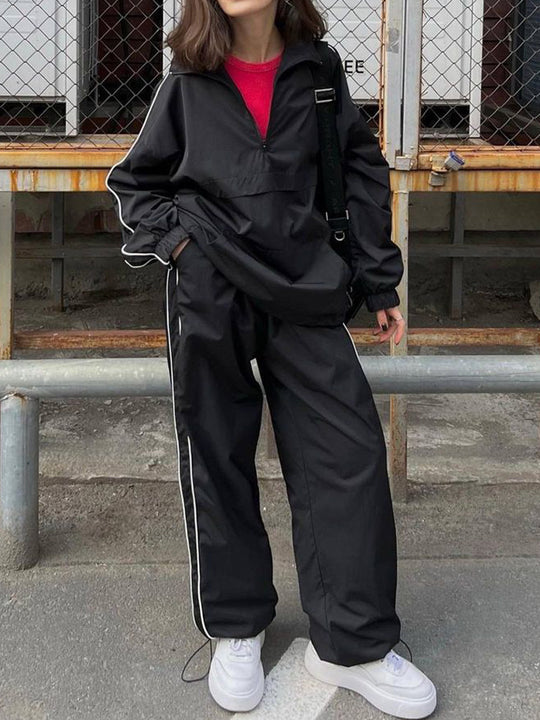 Damen winddichter Crop-Halfzip-Trainingsanzug mit elastischem Bund und kontrastierender Paspel Eichborn Berlin