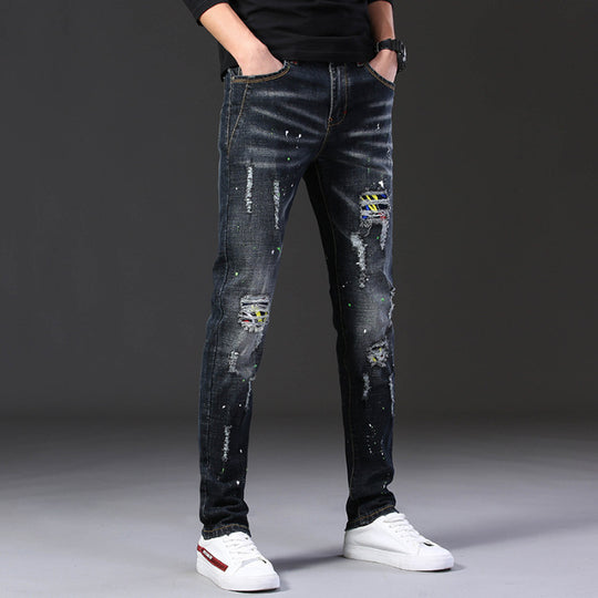 Herren Slim Fit Jeans mit kreativen Rissdesign und Farbklecksen EB