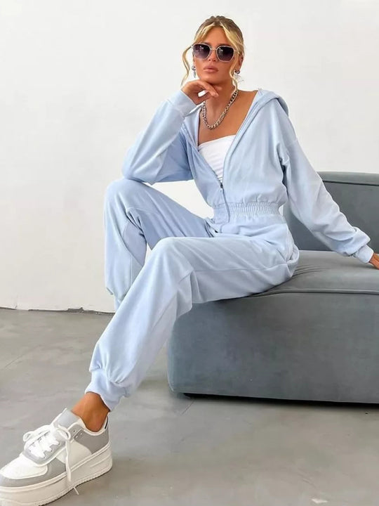 Damen Velours Jumpsuit mit Kapuze, Reißverschluss und tailliertem Gummibund EB