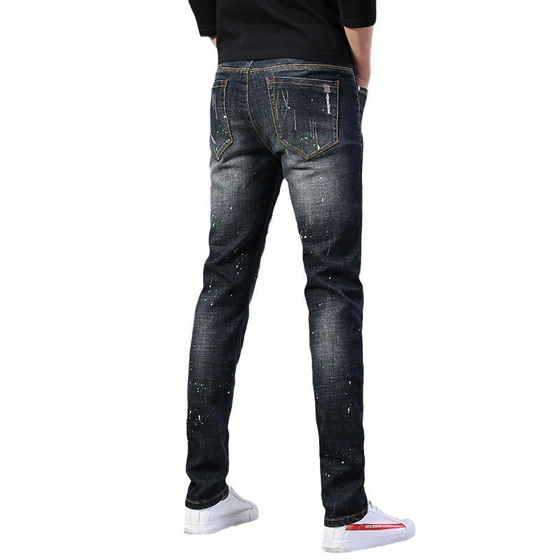 Herren Slim Fit Jeans mit kreativen Rissdesign und Farbklecksen EB