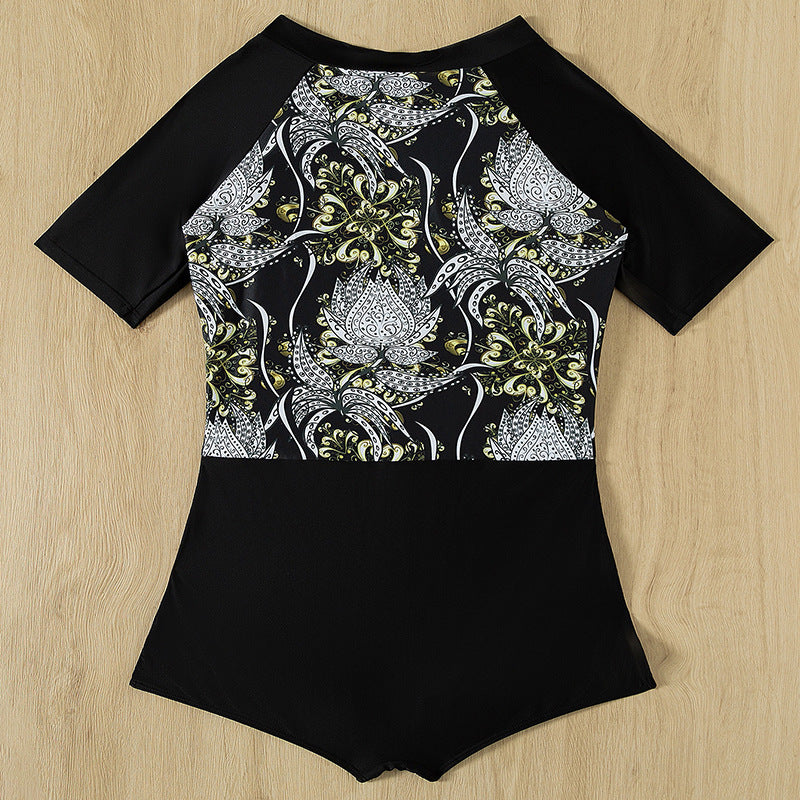 Damen Sporteinteiler mit floralem Design und kurzem Arm EB